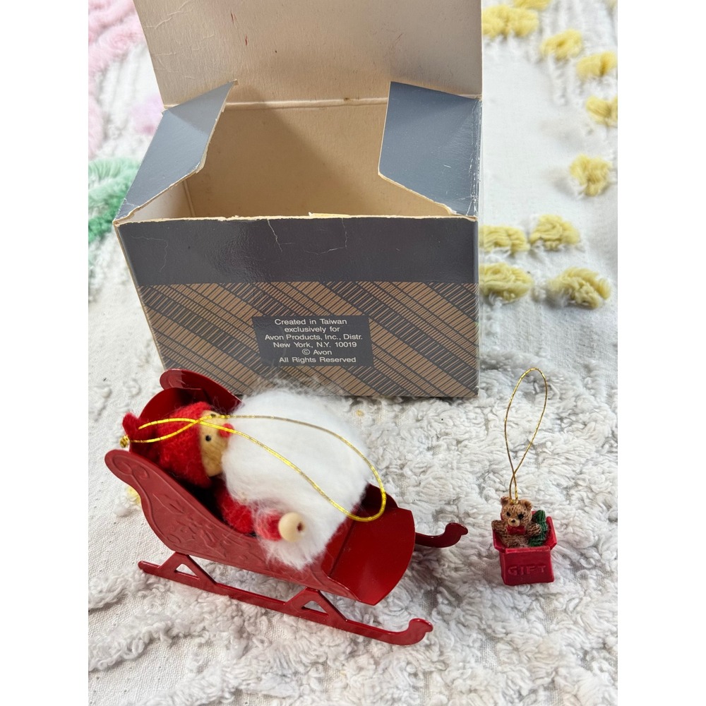 Vintage Avon Frolicking Santas Ornament Collection Santa on a Sleigh with Box